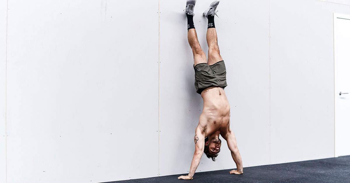 athlete performing handstand push-ups