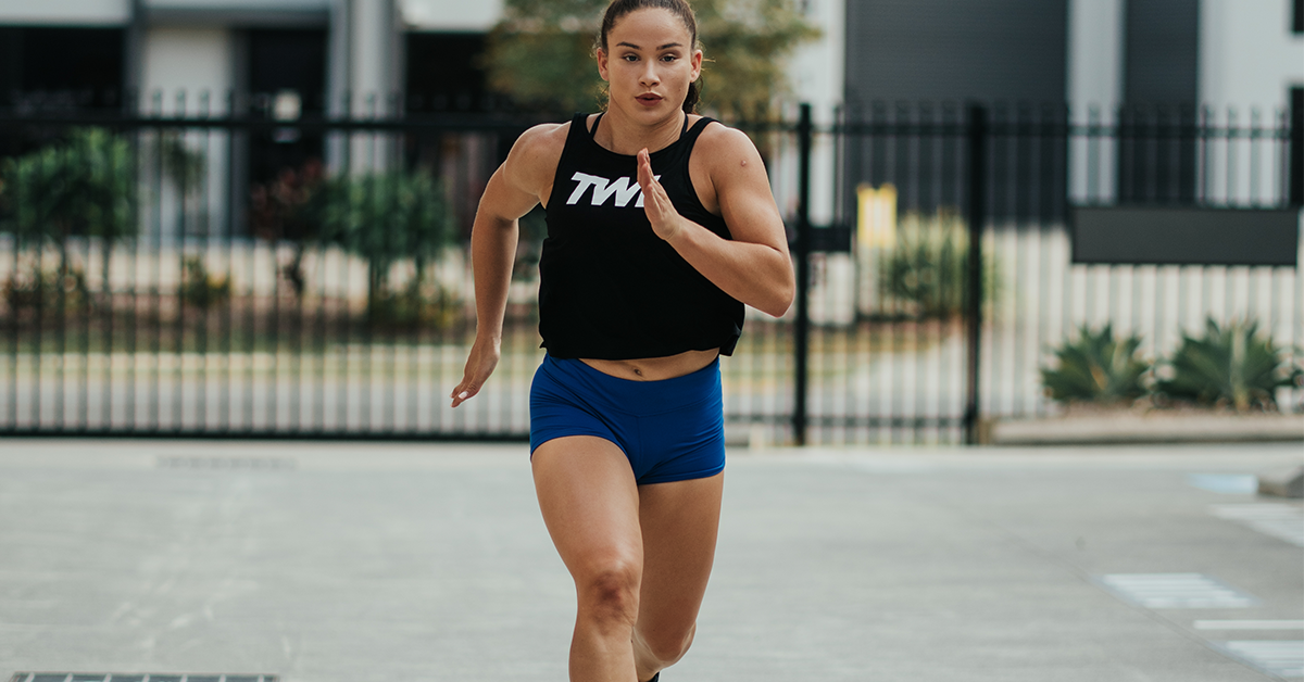 female athlete running outside