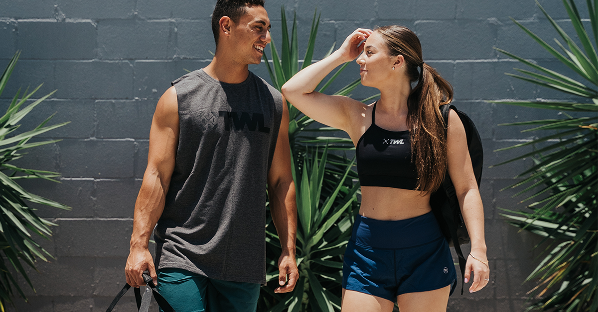 man and woman athlete walking outside