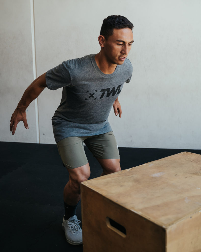 male athlete performing box jumps for beginners