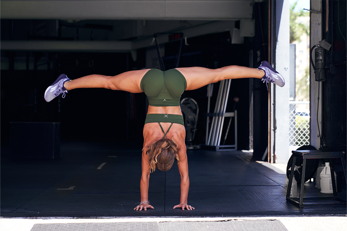 woman doing handstand split