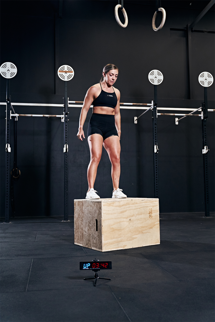 athlete learning how to do box jumps
