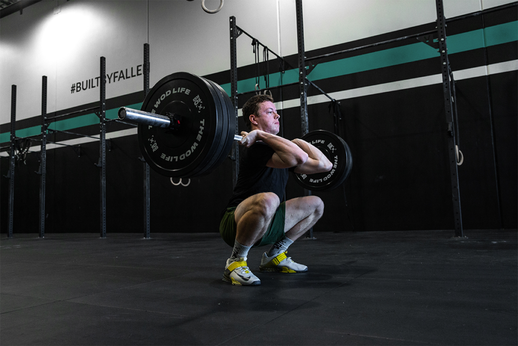 male athlete doing clean and jerk benefits