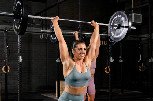 woman doing clean and jerk warmup