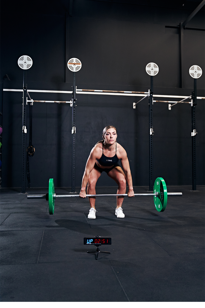 woman performing clean and jerk