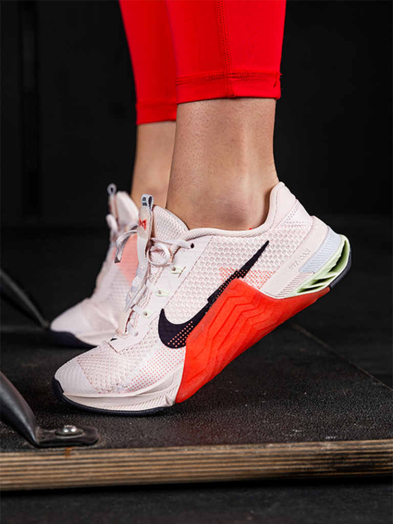 woman wearing Nike Metcon 7s