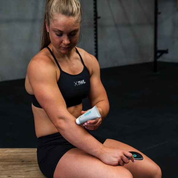 athlete applying balm before muscle scraping