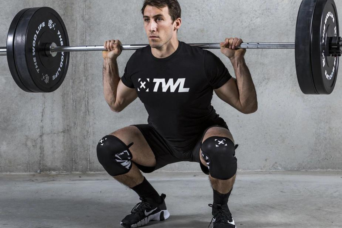 athlete wearing knee sleeves for squatting
