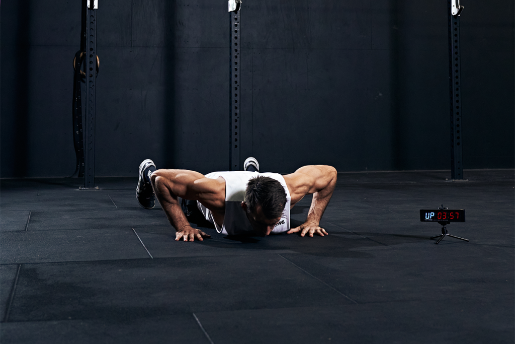 male athlete doing bodyweight exercises to build muscle